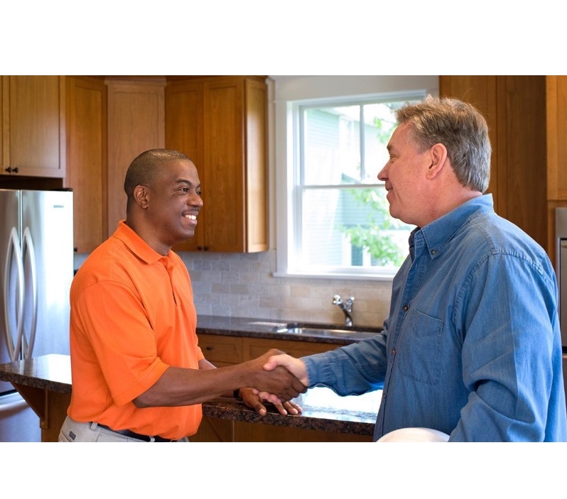 Homeowner shaking hands with a contractor